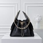 Chanel 25 Handbag, vintage black and gold, classic chain design